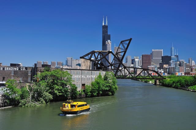 The Chicago skyline with a water taxi on the river