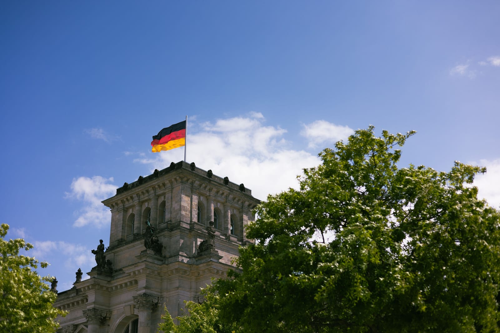 The Reichstag in Berlin with the German flag on its roof