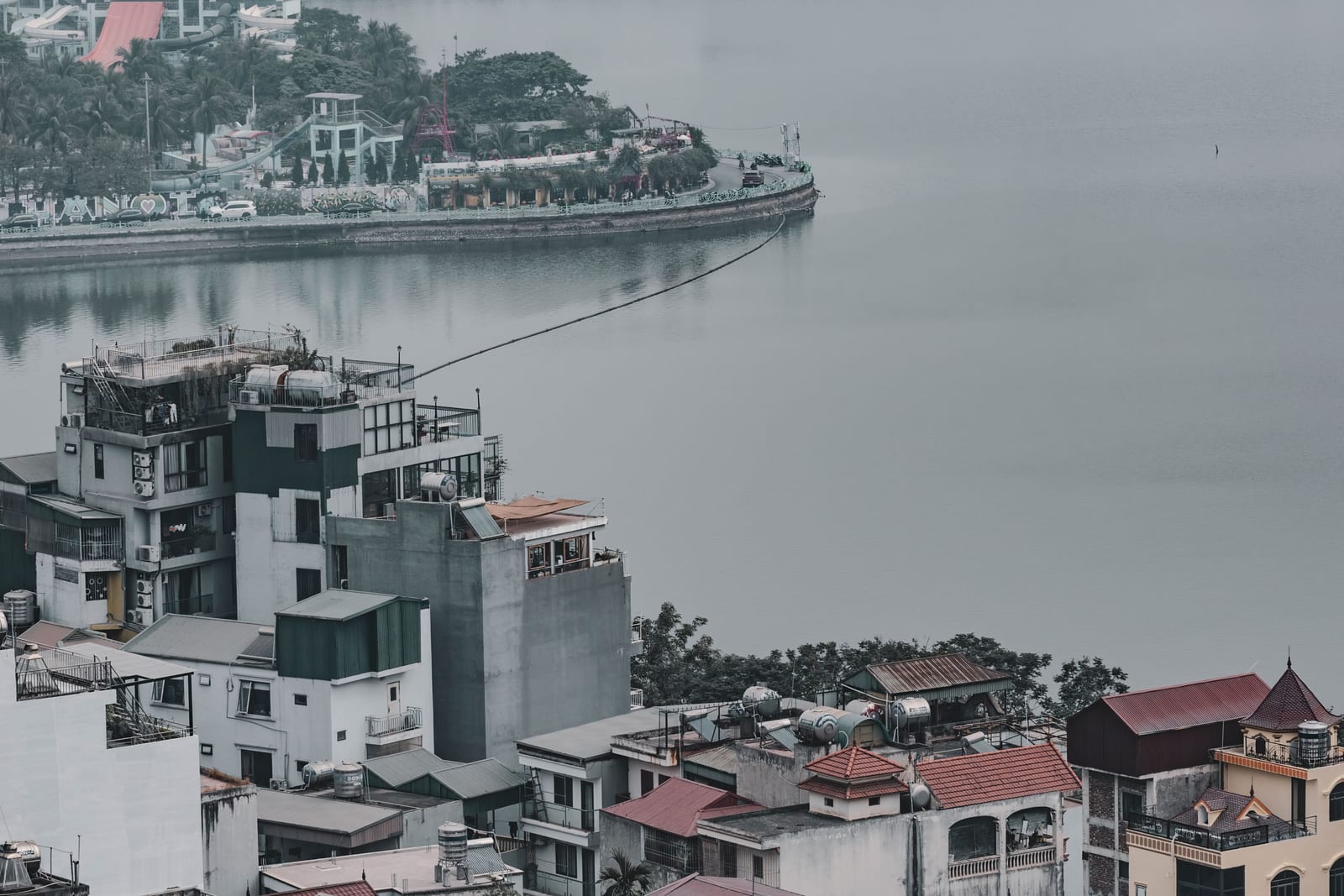 Houses and a lake in Hanoi seen from above